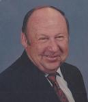 Gerald E.  Kuhns